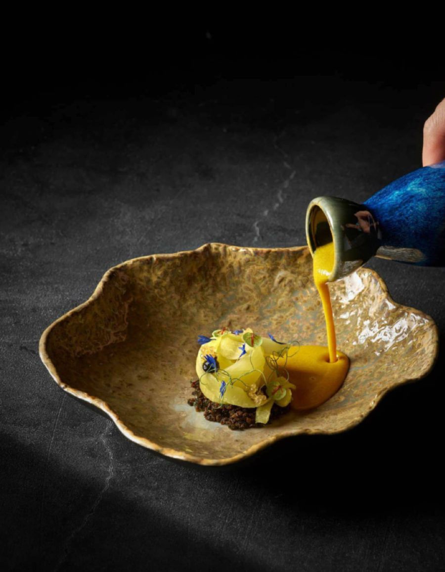 Chef Eliyaz preparing a signature dish